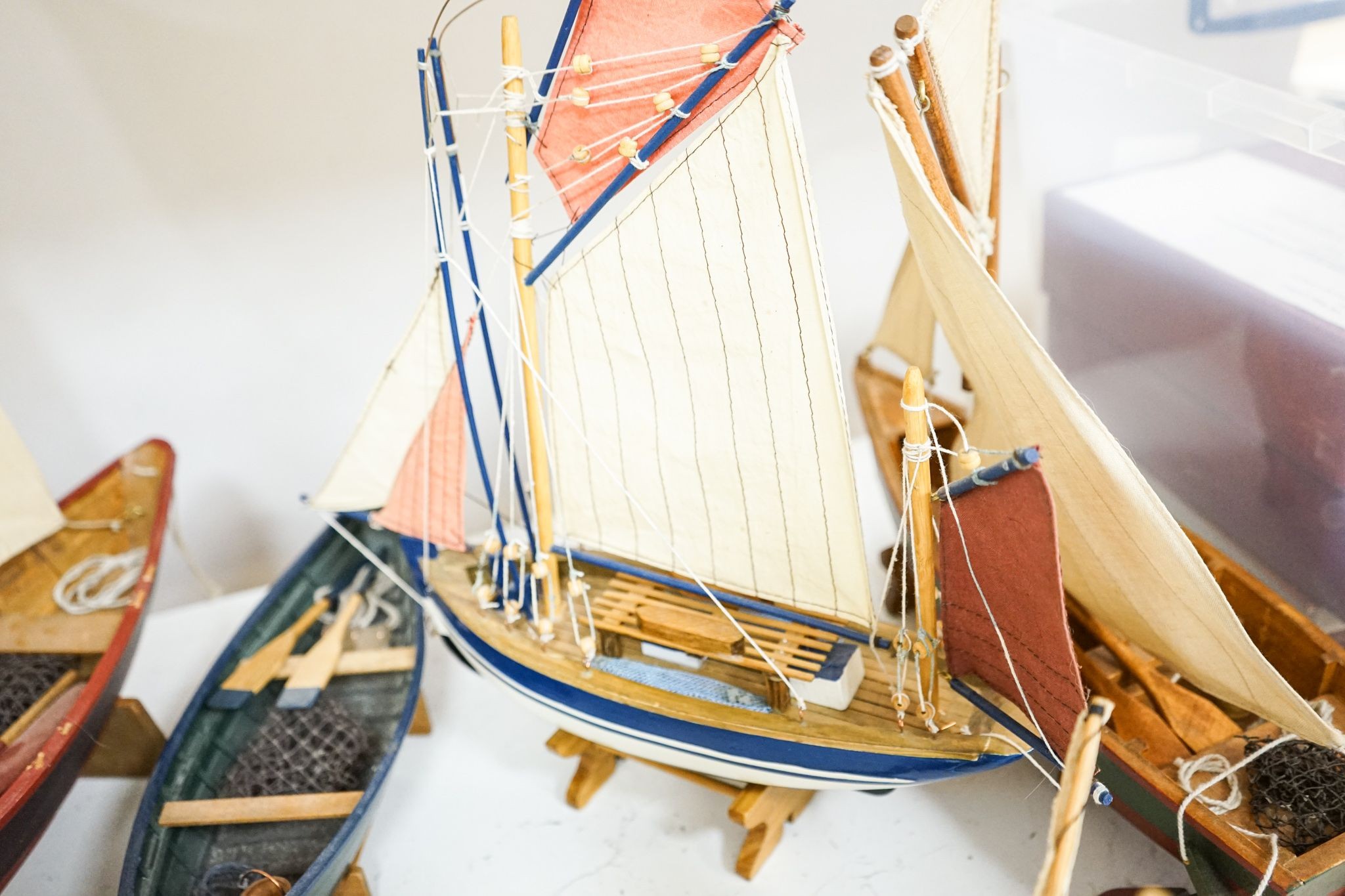 A group of six painted wood boat models